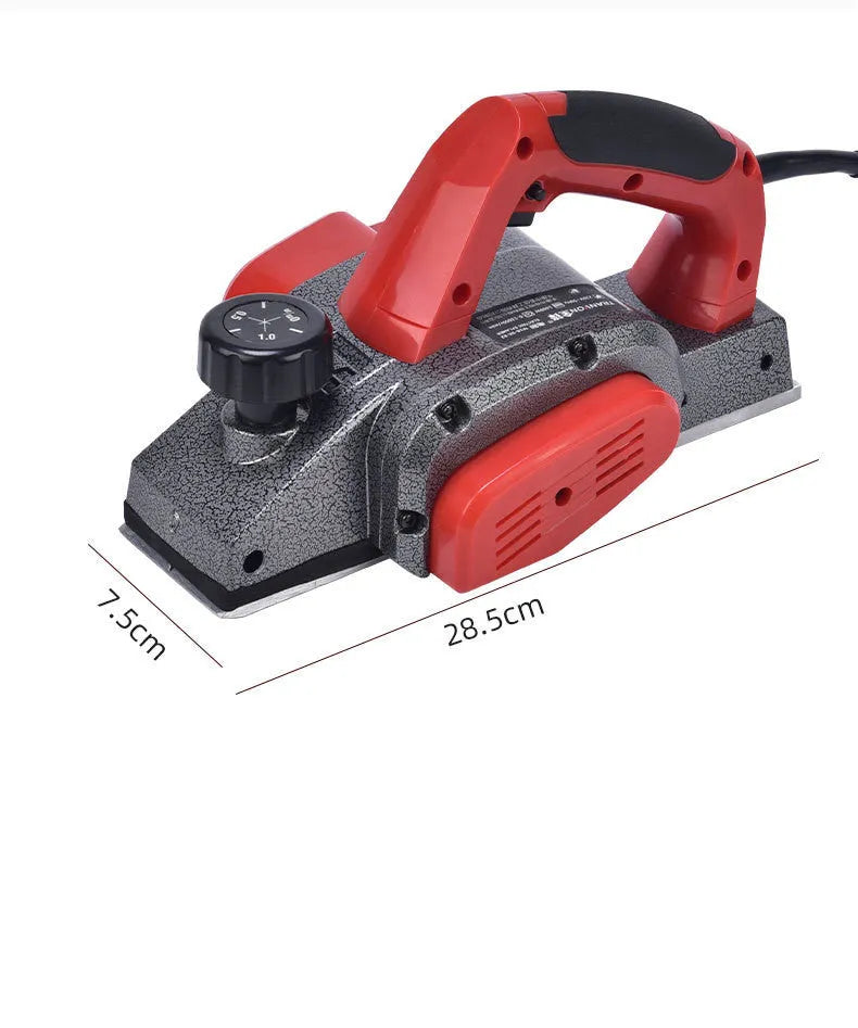 Red desktop electric wood planer with aluminium body, showing 82mm planing width