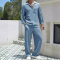 Man wearing a lake blue casual shirt and trouser suit set for commuting.