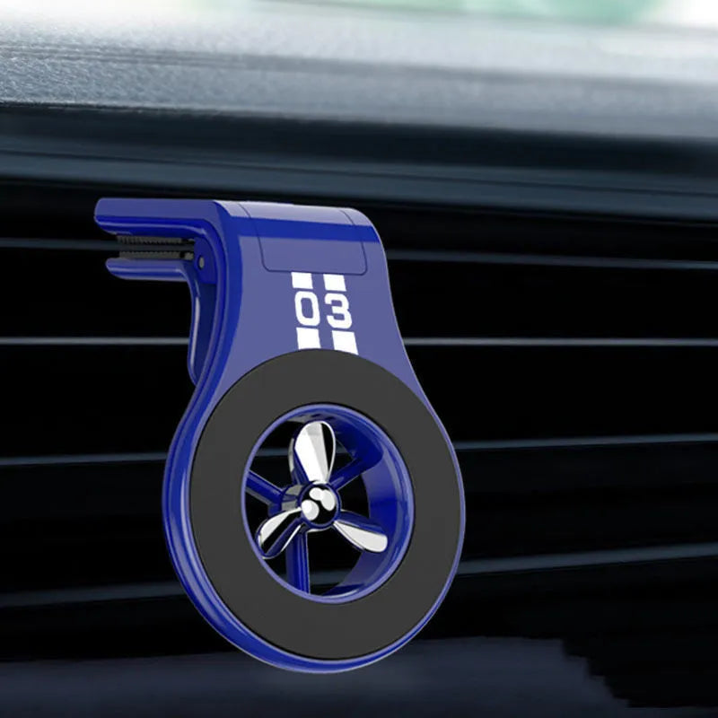 Magnetic car phone holder with fragrance diffuser clipped to car air vent