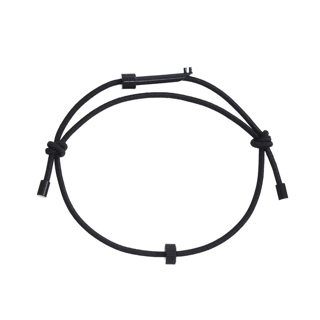 Tungsten carbide adjustable emergency escape bracelet with window breaker tip on grey background