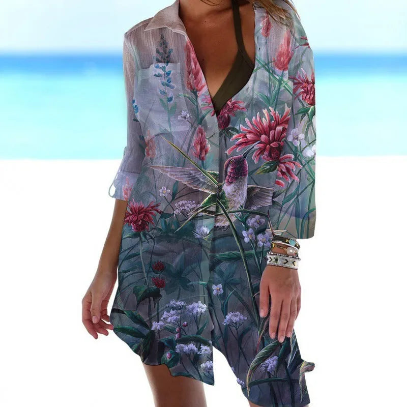 Women's long sleeve cardigan with 3D printed bird and flower painting pattern, on a hanger.