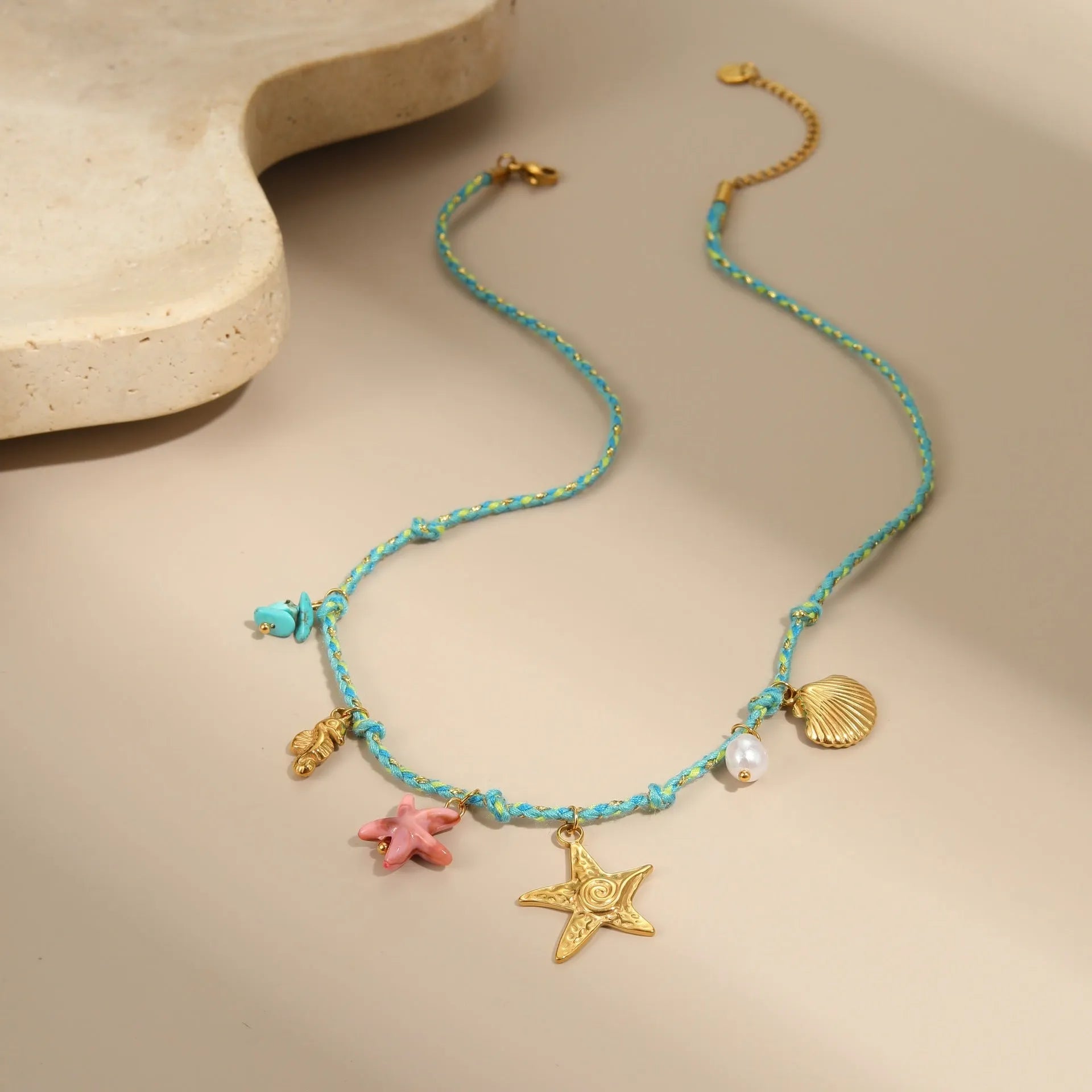 Handmade stainless steel necklace with coloured braided rope detail and geometric pendant