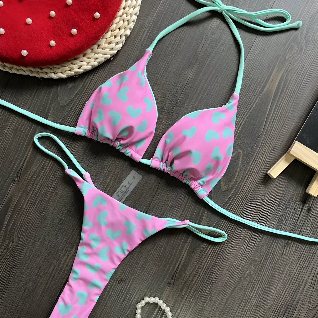 Women's red heart print backless one-piece swimsuit with a side split.