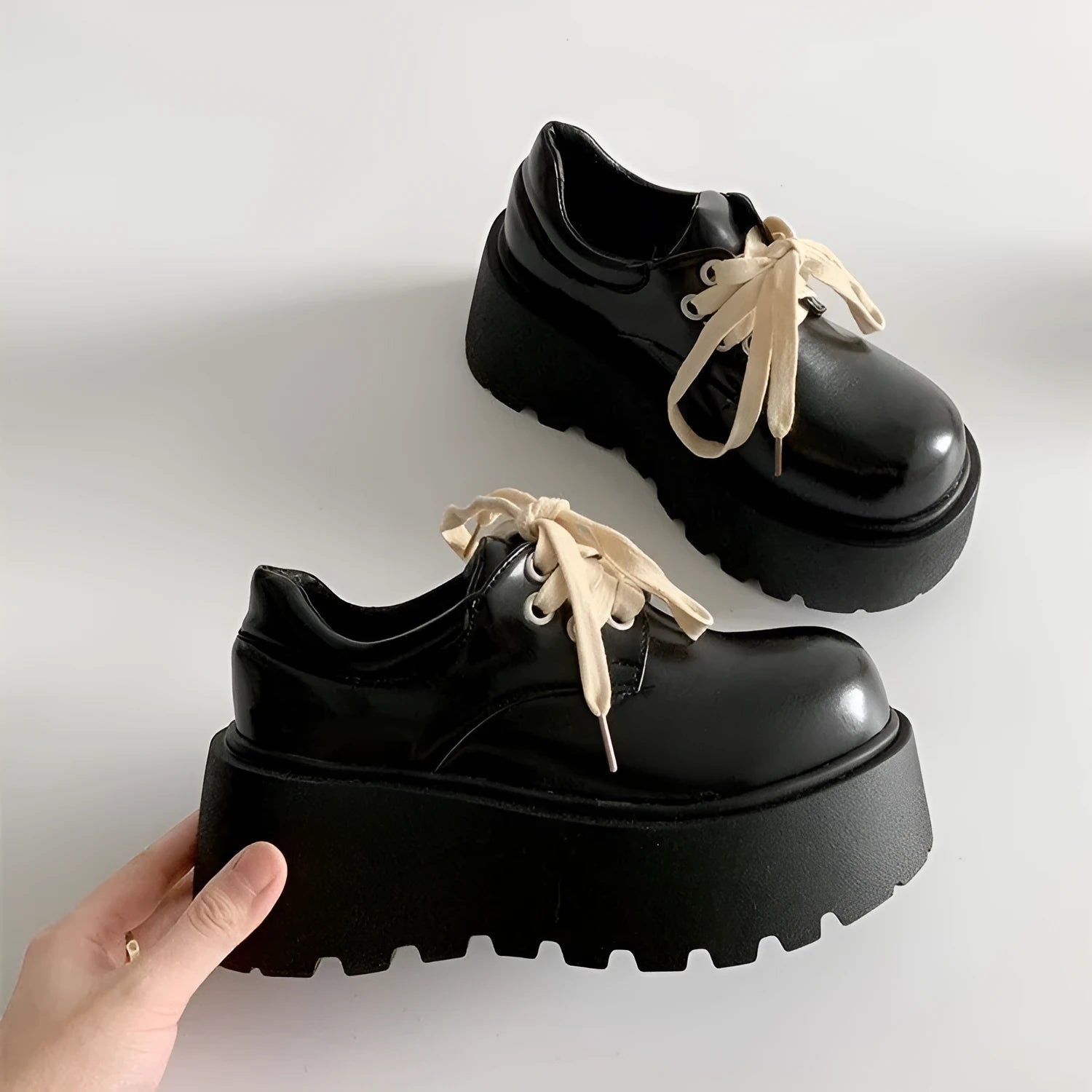 Black matte women's lace-up platform shoes with a chunky 6-8cm rubber sole and round toe.