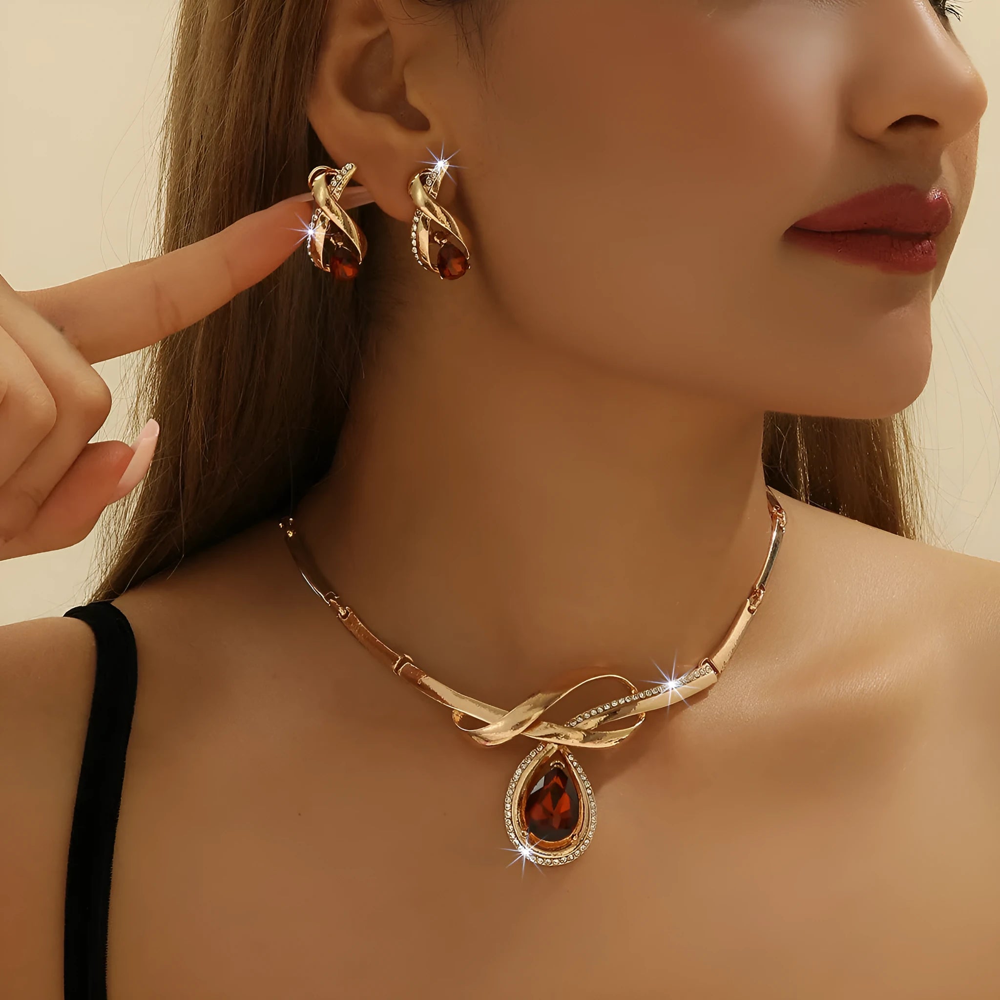 Gold alloy necklace and earrings set with white rhinestone and brown crystal inlay, V-shaped pendant, fishtail fan design