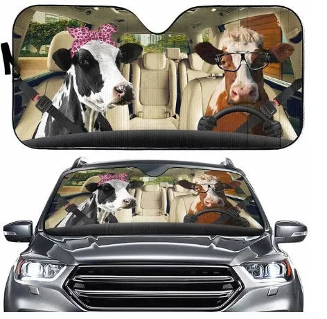 Telescopic aluminium foil car sun shield expanded on a dashboard