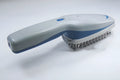 Negative ion pet comb with removable brush head for grooming and odour removal