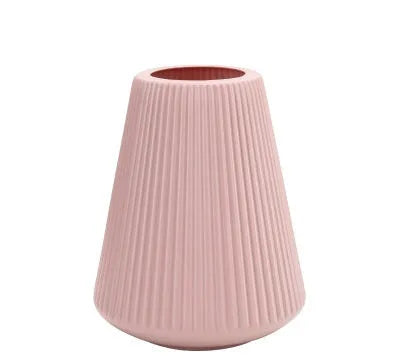 Blue, green, pink, and white melamine plastic decorative vase measuring 16cm by 20cm on a desktop.
