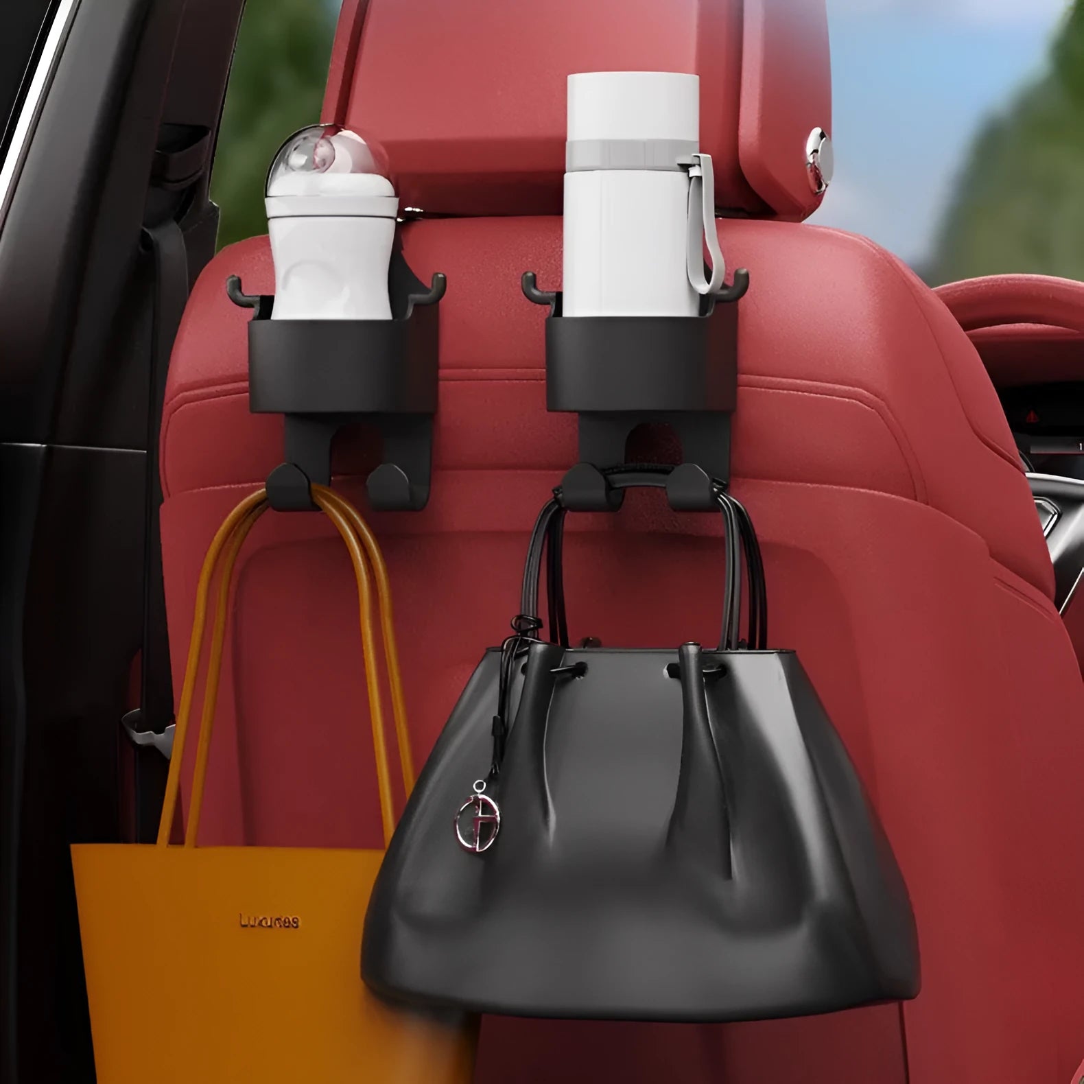 Black plastic car seat back hook with cup holder and hanging hooks for in-car organisation.