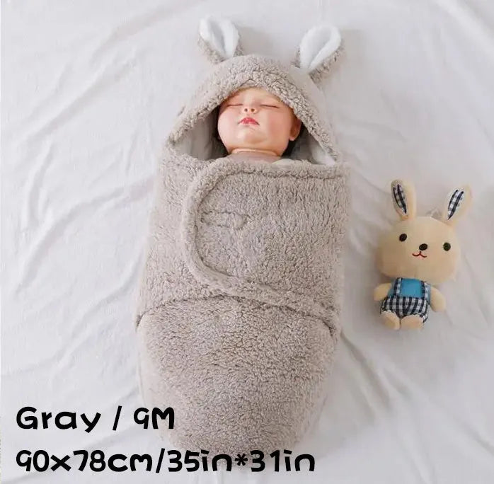 Adjustable baby sleeping bag swaddle blanket showing velcro wings and leg positioner in blue colour