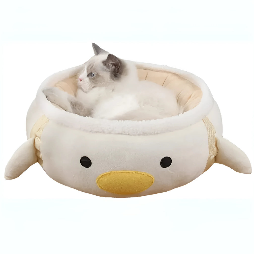 Green dinosaur chick design cat bed shown both flat and hanging, for small cats and dogs.