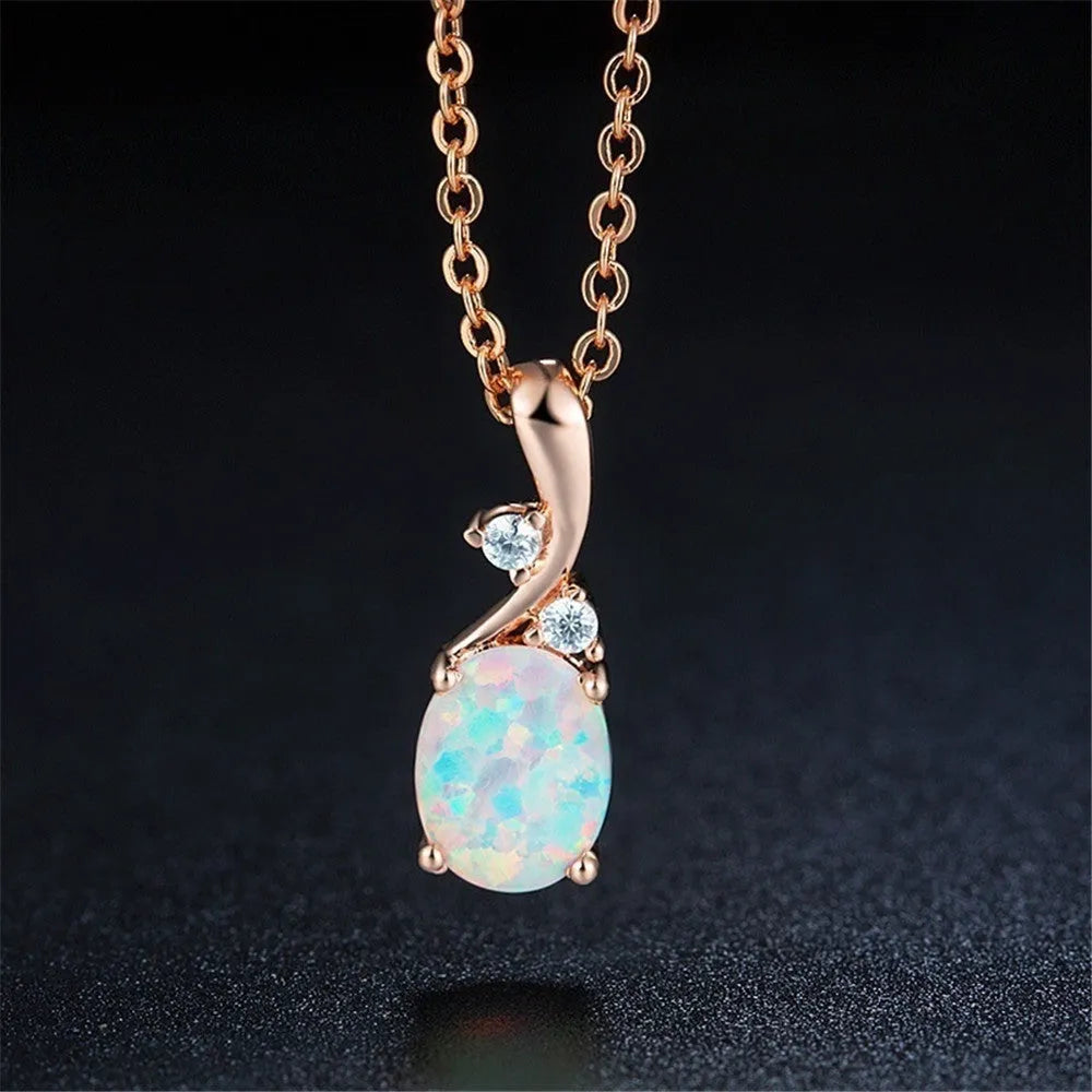 Water drop shaped opal pendant necklace on an adjustable chain in rose gold or white colour.