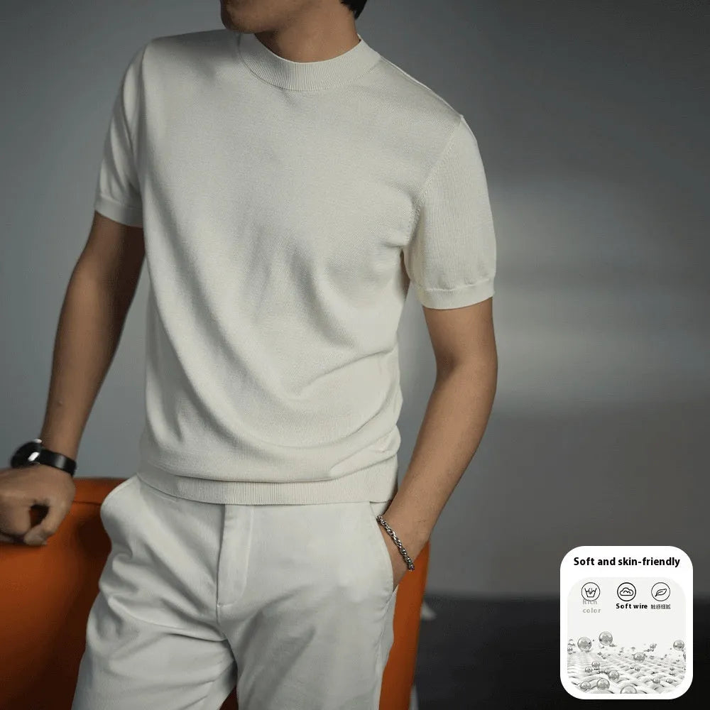 Man wearing a silver grey knitted round neck t-shirt with short sleeves.