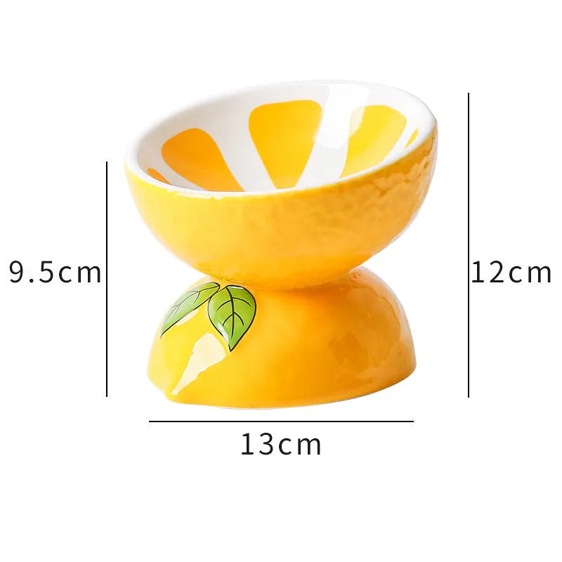 Ceramic raised cat bowl with elevated stand and wide tilted dish in fruit pattern.
