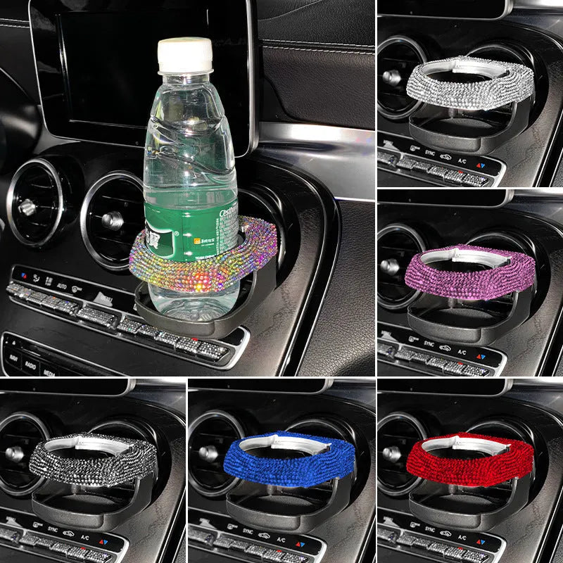White diamond rhinestone car air vent cup holder bracket on a grey car dashboard.