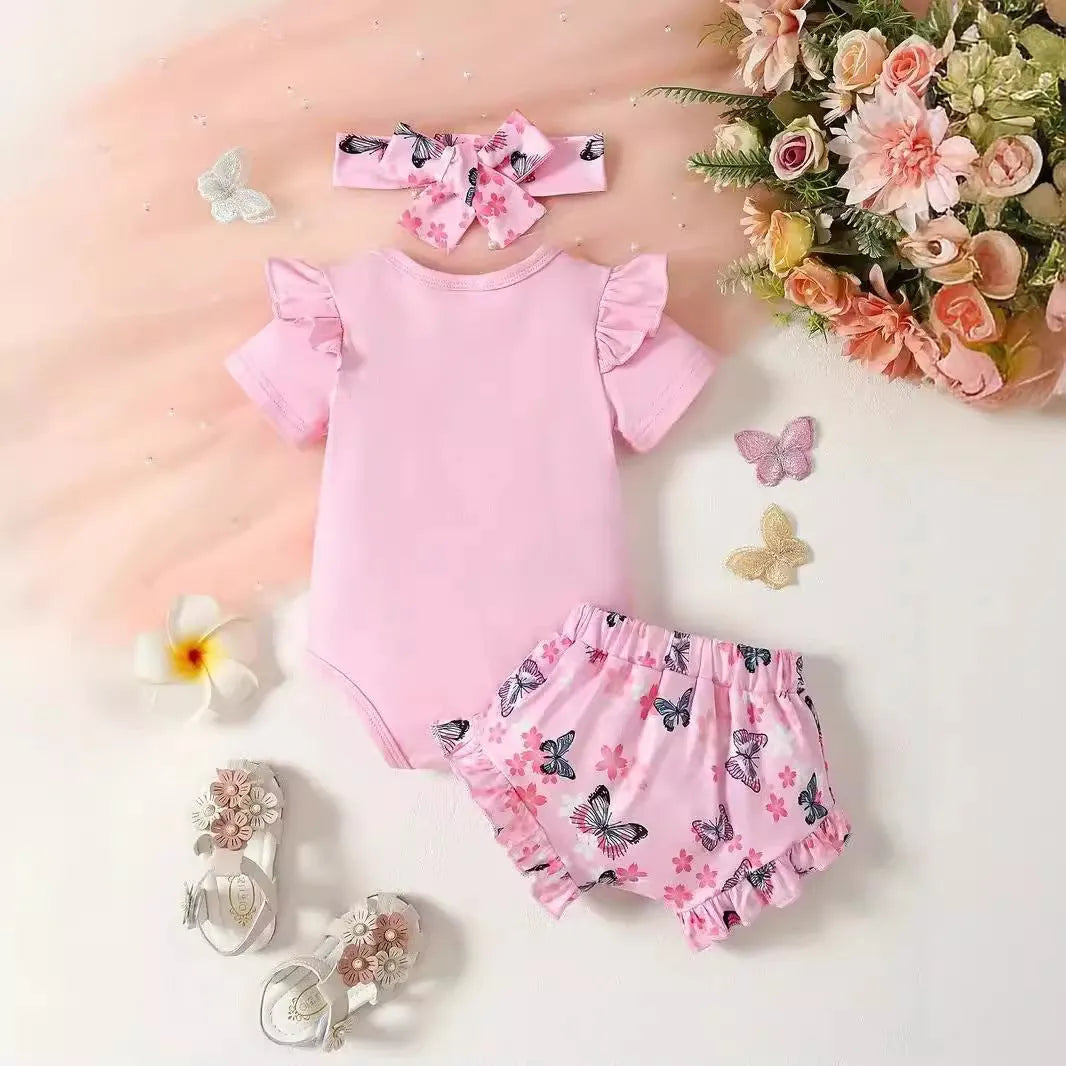 Peach baby girl two-piece summer suit with short sleeve shirt, shorts and letter print.