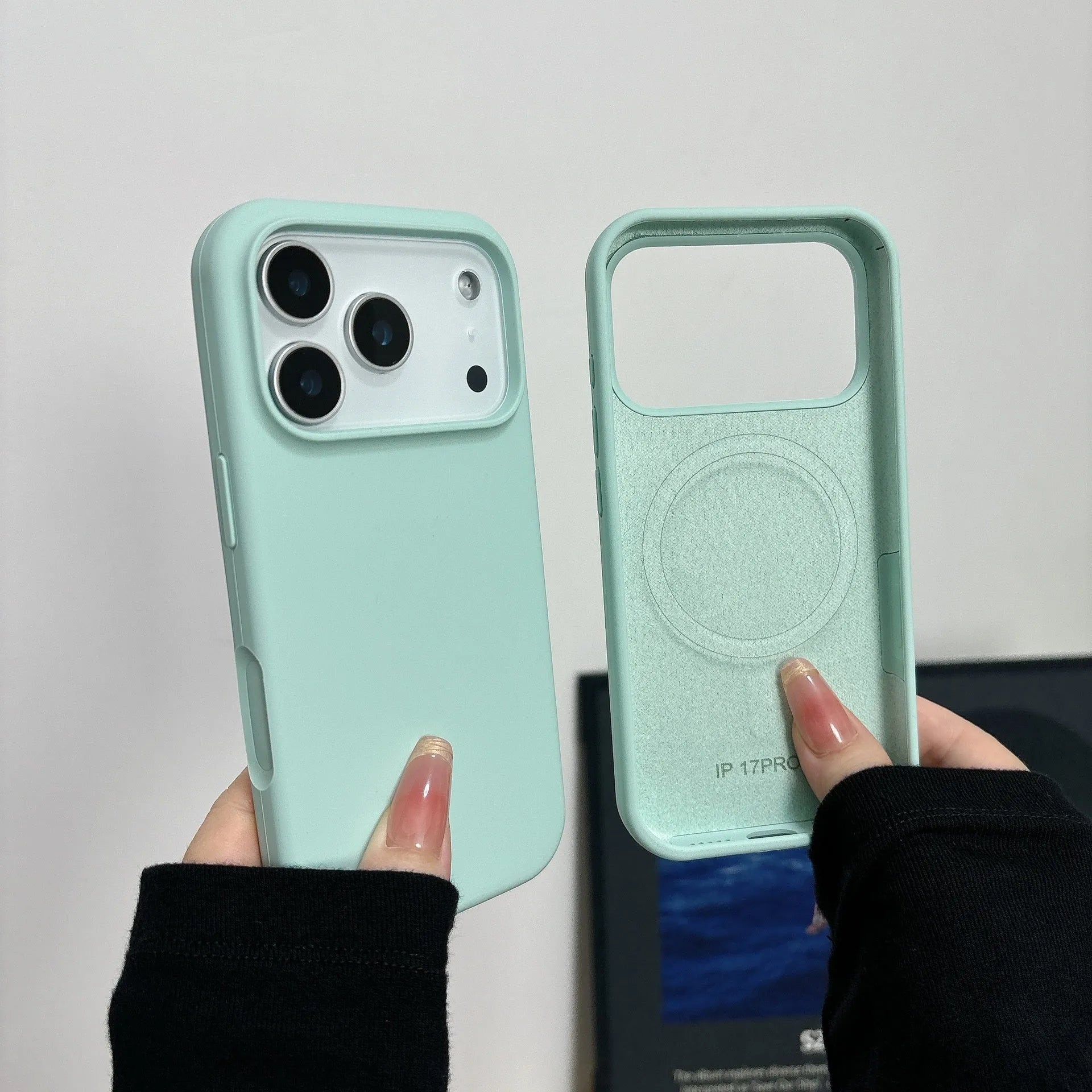 Liquid silicone iPhone case with integrated magnetic charging port, shown in Antique White colour.
