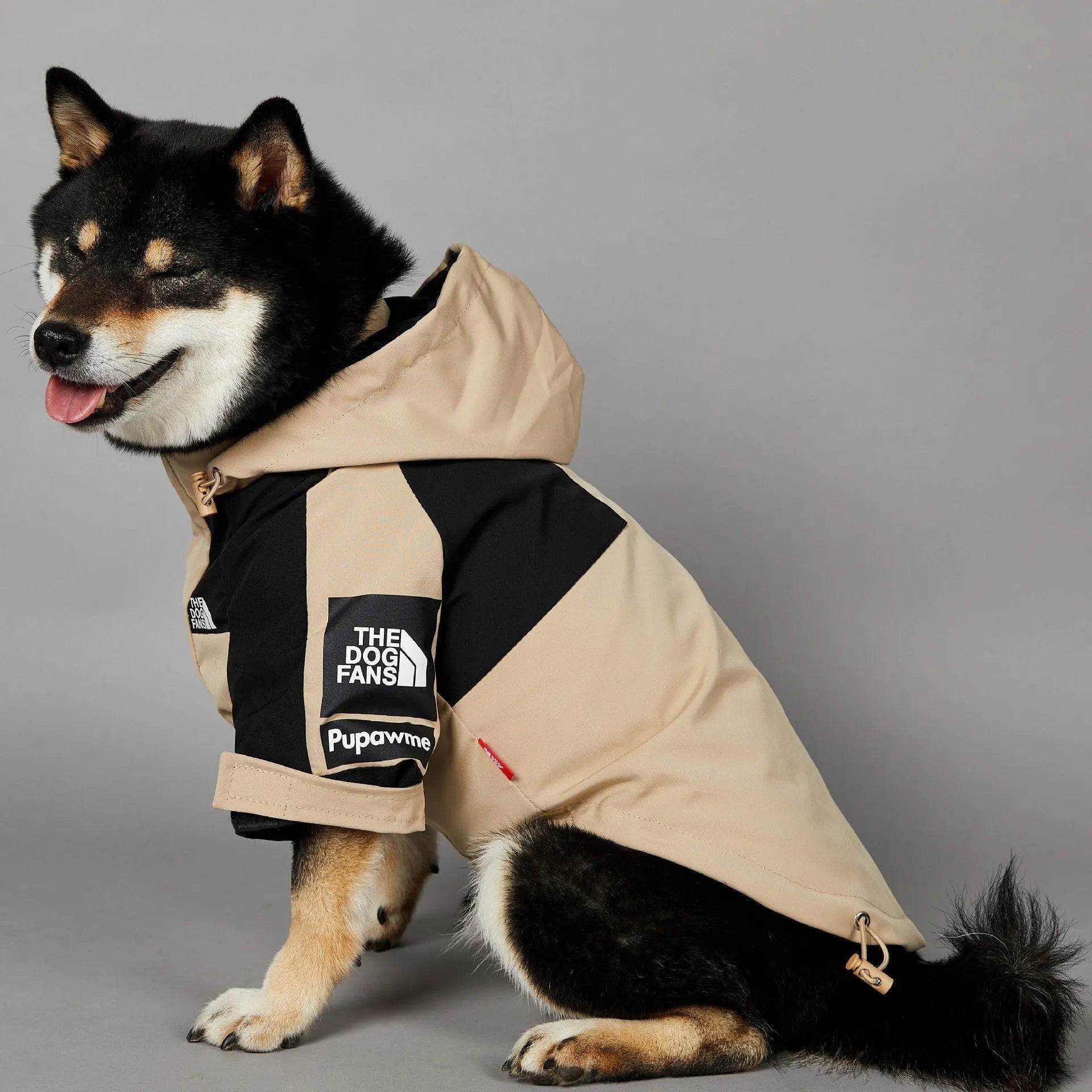 Khaki coloured polyester shell jacket for a dog on a size chart showing S, M, L, XL, 2XL, 3XL, 4XL, and 5XL.