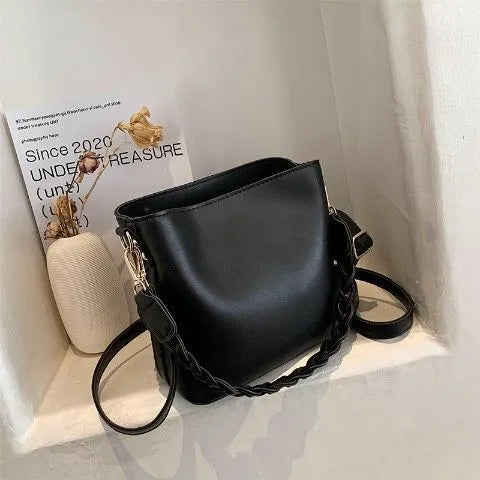 Retro brown PU bucket bag with weaving detail, shown as a one-shoulder crossbody underarm bag.