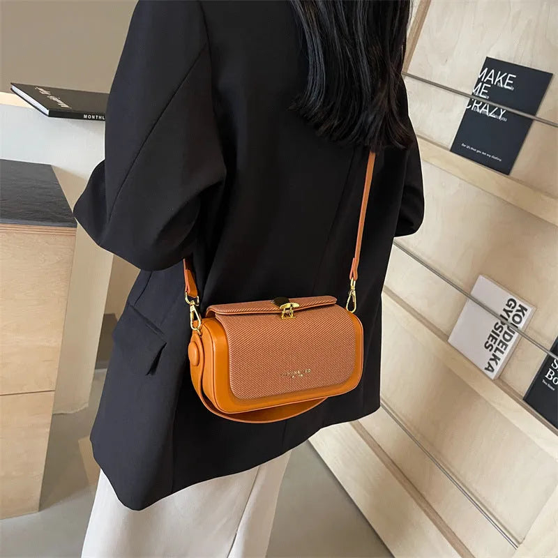 Women's square PU messenger bag in beige with contrast stitching and a single shoulder strap.