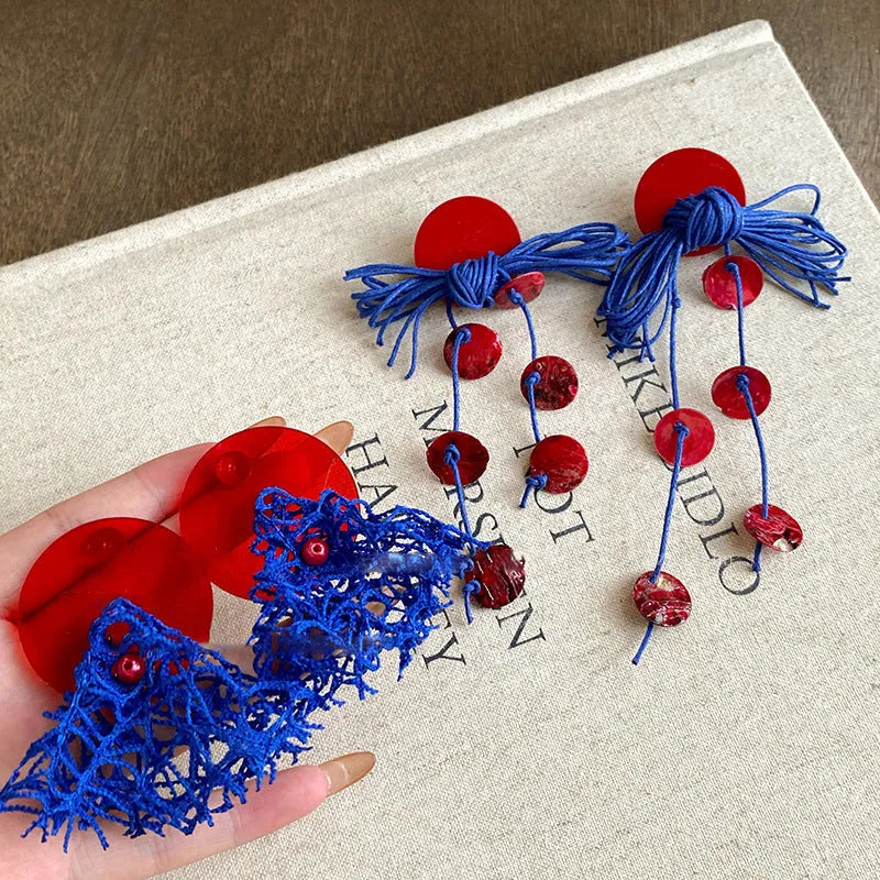 Women's geometric cloth earrings with blue resin flower detail and Silver Needle colour