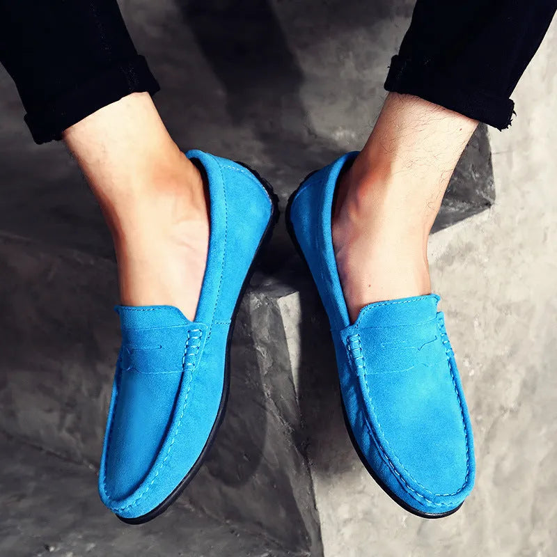 Men's suede Gommino loafers in dark green with round toe, sewing details, and a rubber sole.