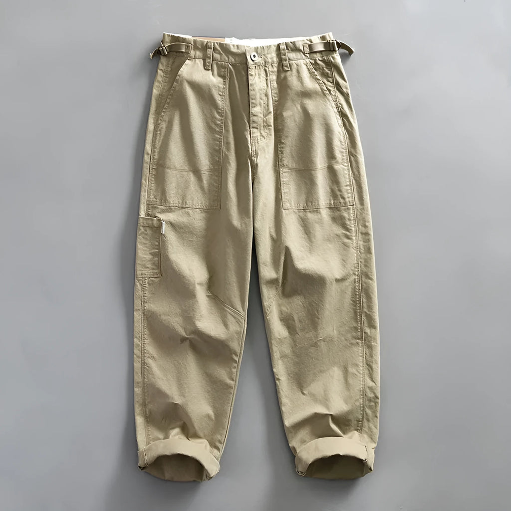 Men's straight-leg cotton casual trousers in apricot colour on a hanger