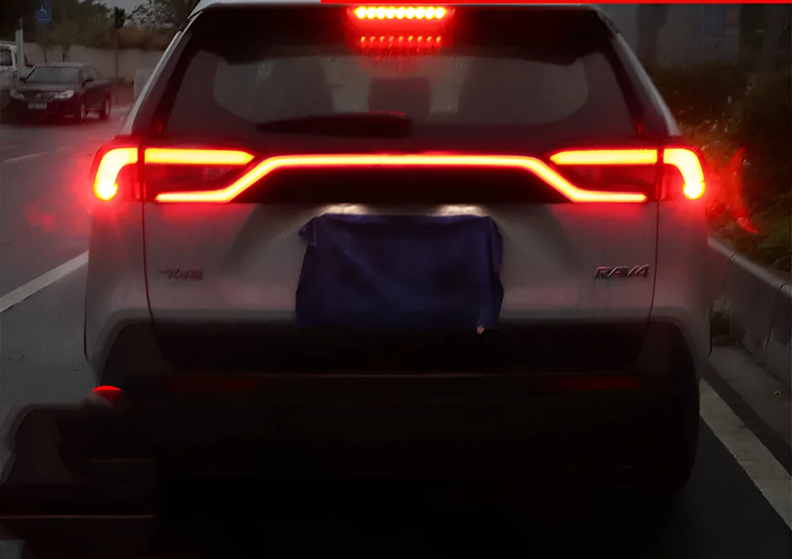 Three-function modified run-through car tail light for 2019-2020 Toyota RAV4 with ABS housing and imported LED