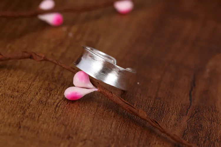 Adjustable open ring with geometric design and frosted sterling silver finish
