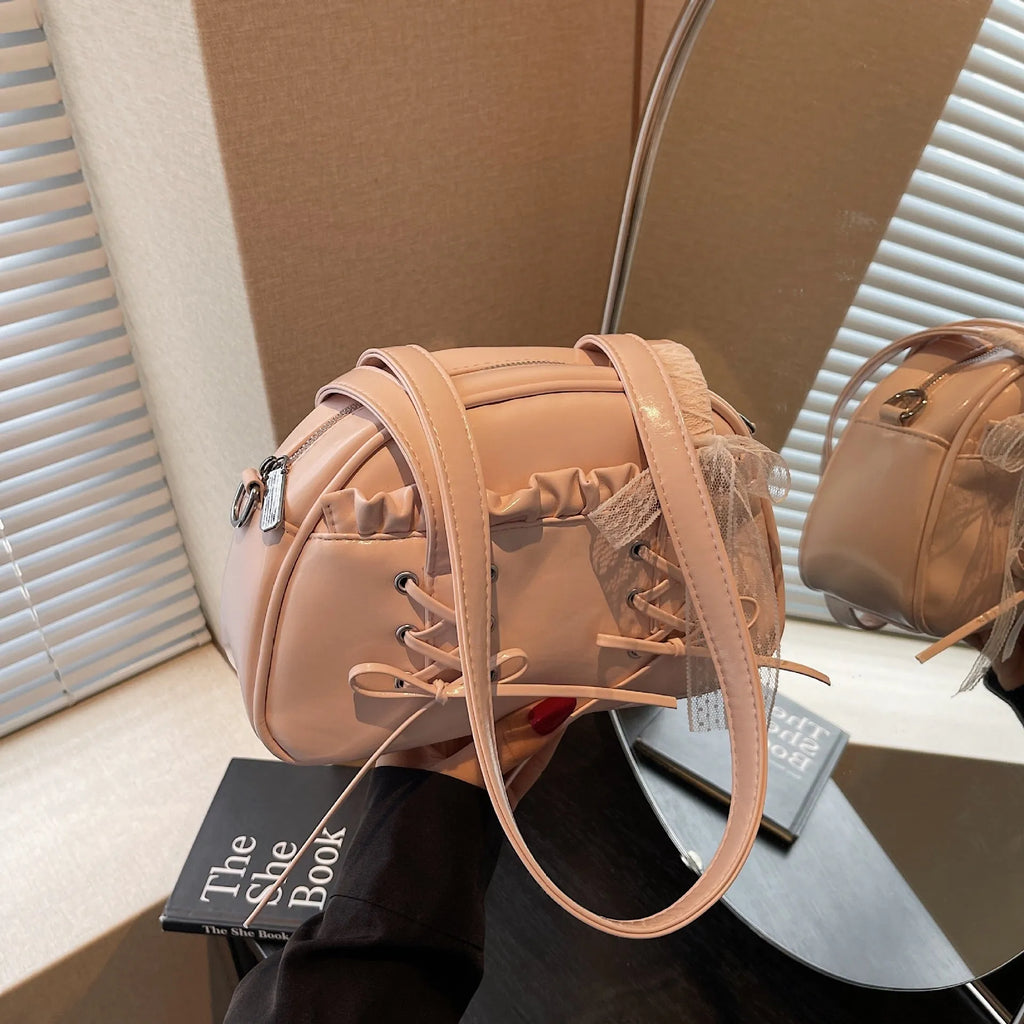 Casual ladies shoulder handbag with bandage bow detail in PU material showing mobile phone compartment