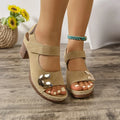 Women's light brown Roman sandals with multiple straps and Velcro fastening on a rubber sole.