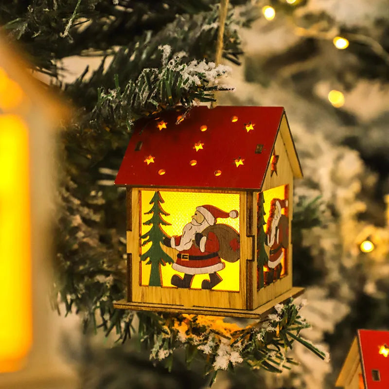Decorative festive luminous wooden pendant with battery, showing snowman shape on a Christmas tree branch