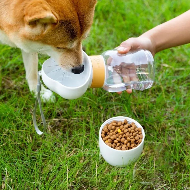 Portable dog water bottle with 2-in-1 water dispenser and food container, rotary switch, and attached belt, in purple colour.