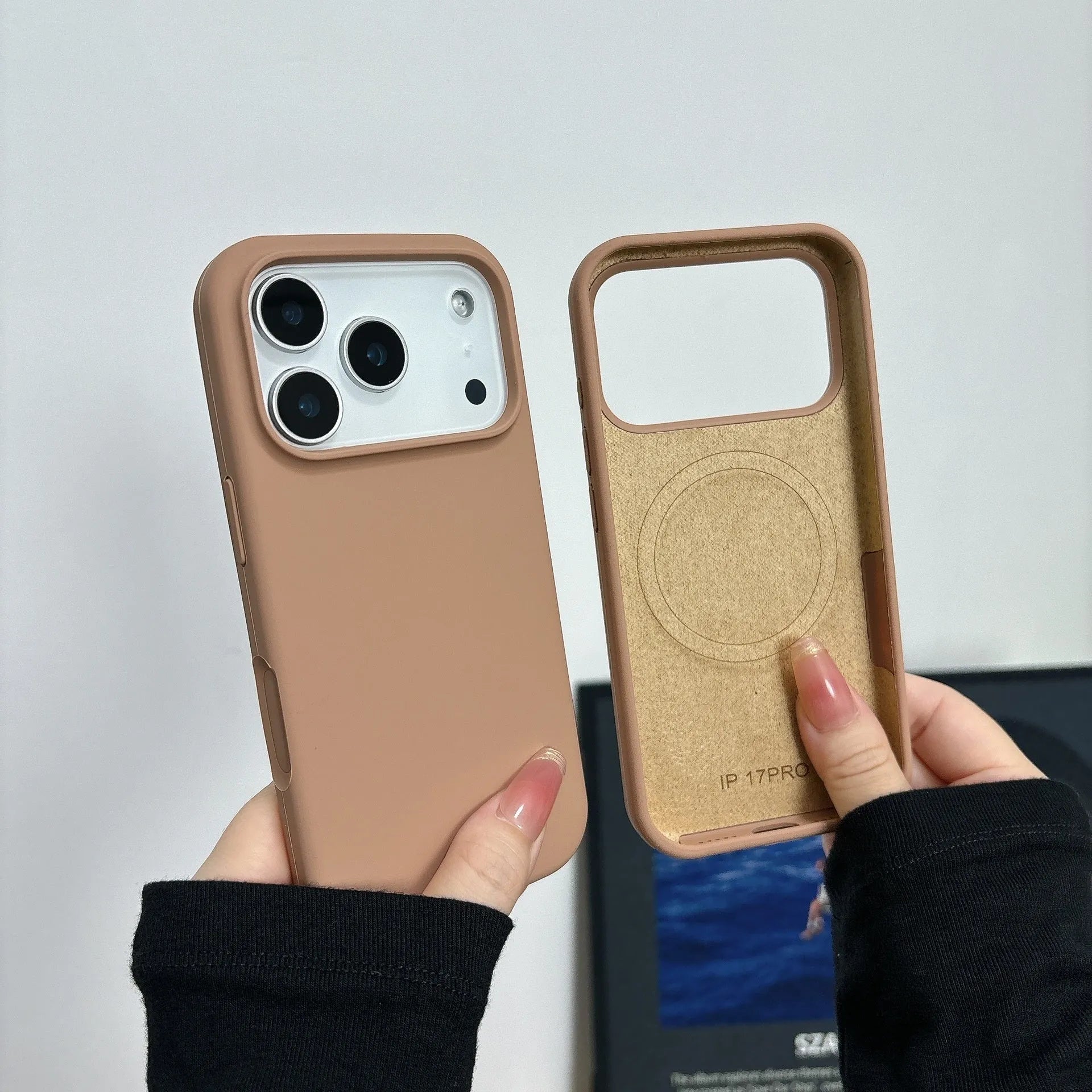 Liquid silicone iPhone case with integrated magnetic charging port, shown in Antique White colour.