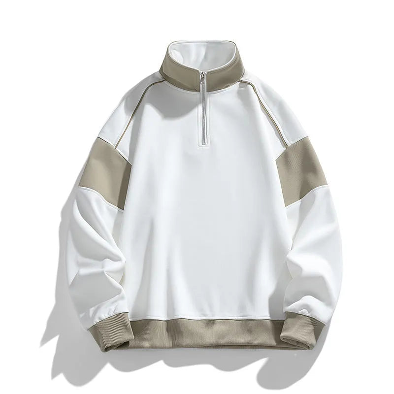 Man wearing a beige drop shoulder hooded corduroy pullover sweater with loose lapels