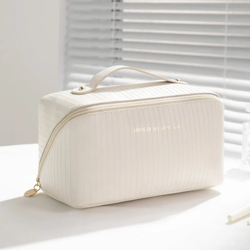 Vertical pattern cubic PU makeup bag in beige, 22.5cm length, for travel cosmetics storage.