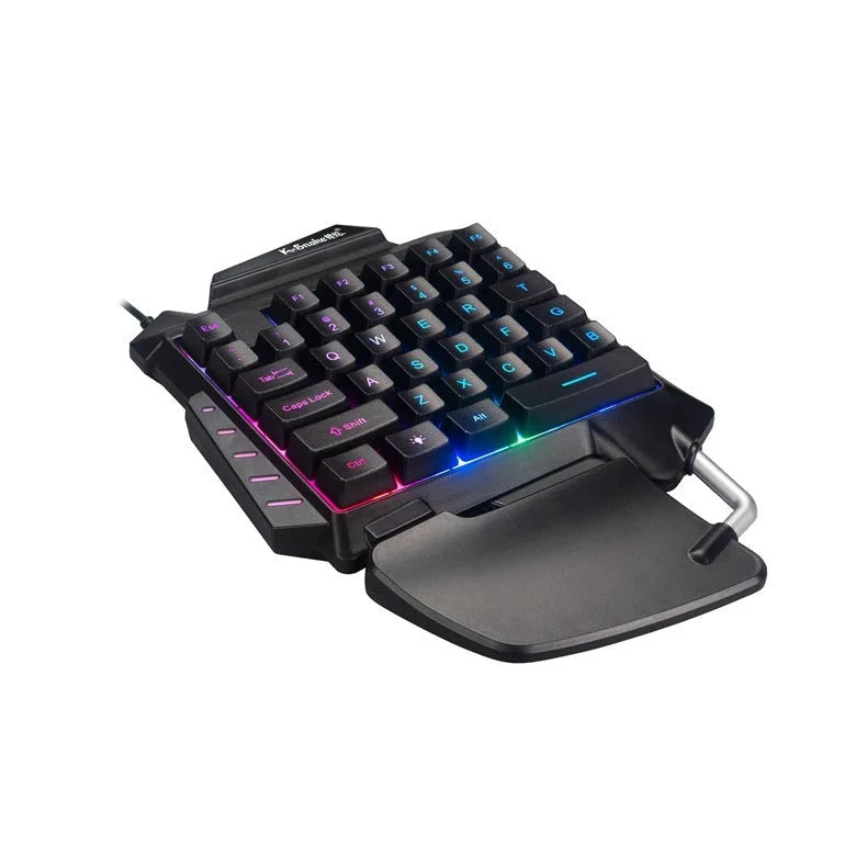 Black left-hand gaming keyboard with throne converter design showing multimedia keys and integrated wrist rest
