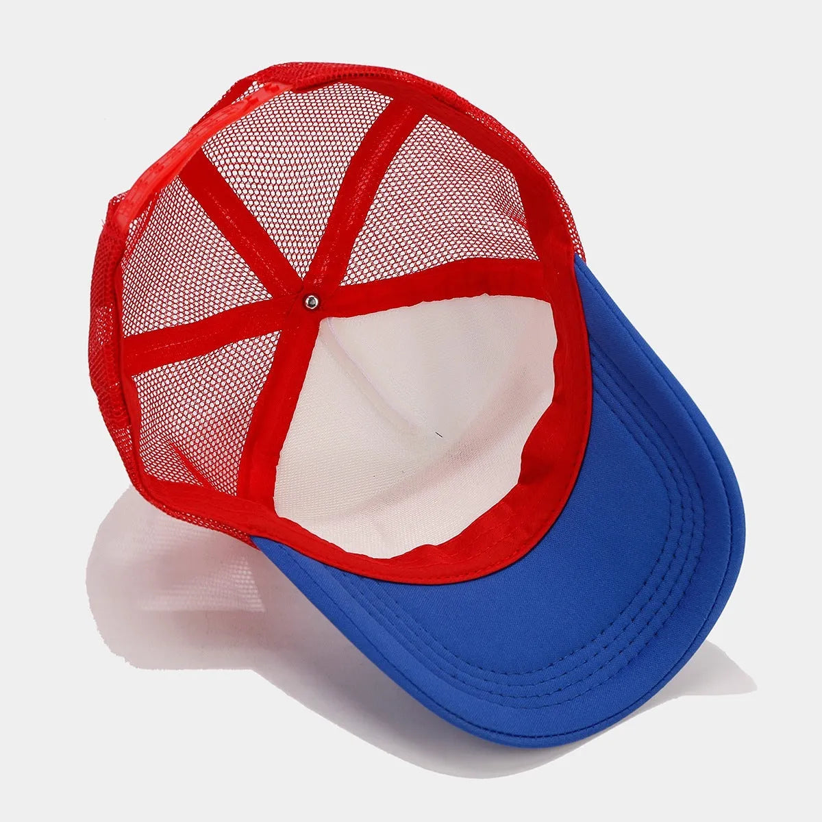Red and blue colour block mesh baseball cap with adjustable strap on a dome crown.