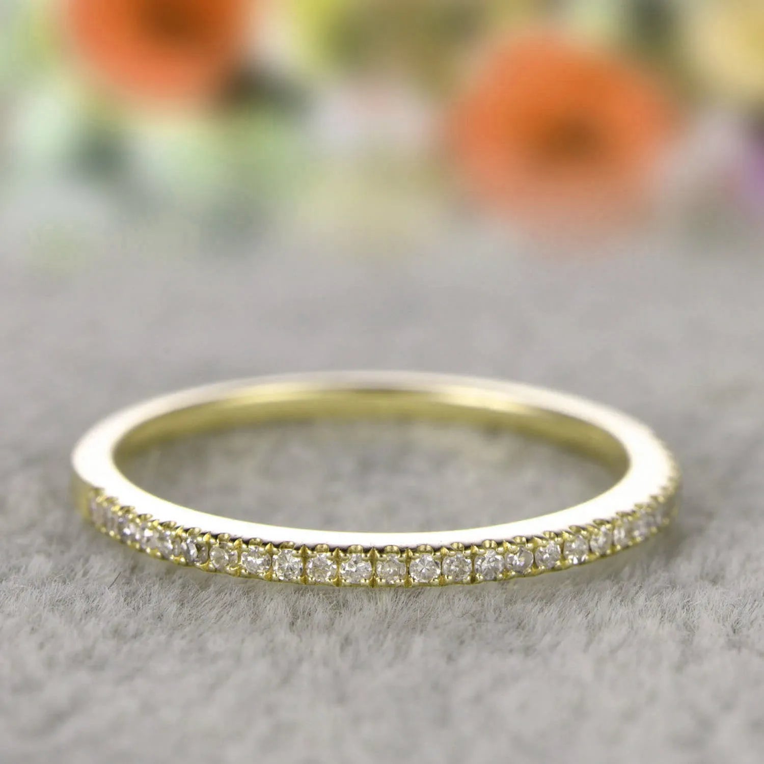 Gold-plated copper ring with hollow geometric setting and inlaid zircon stones