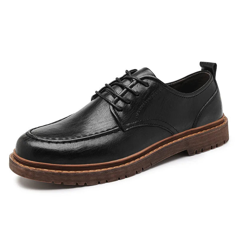 Men's black and brown low top casual leather shoes with round toe and rubber sole.