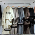 Women's light brown knit cardigan vest and suspender pants three-piece set laid flat
