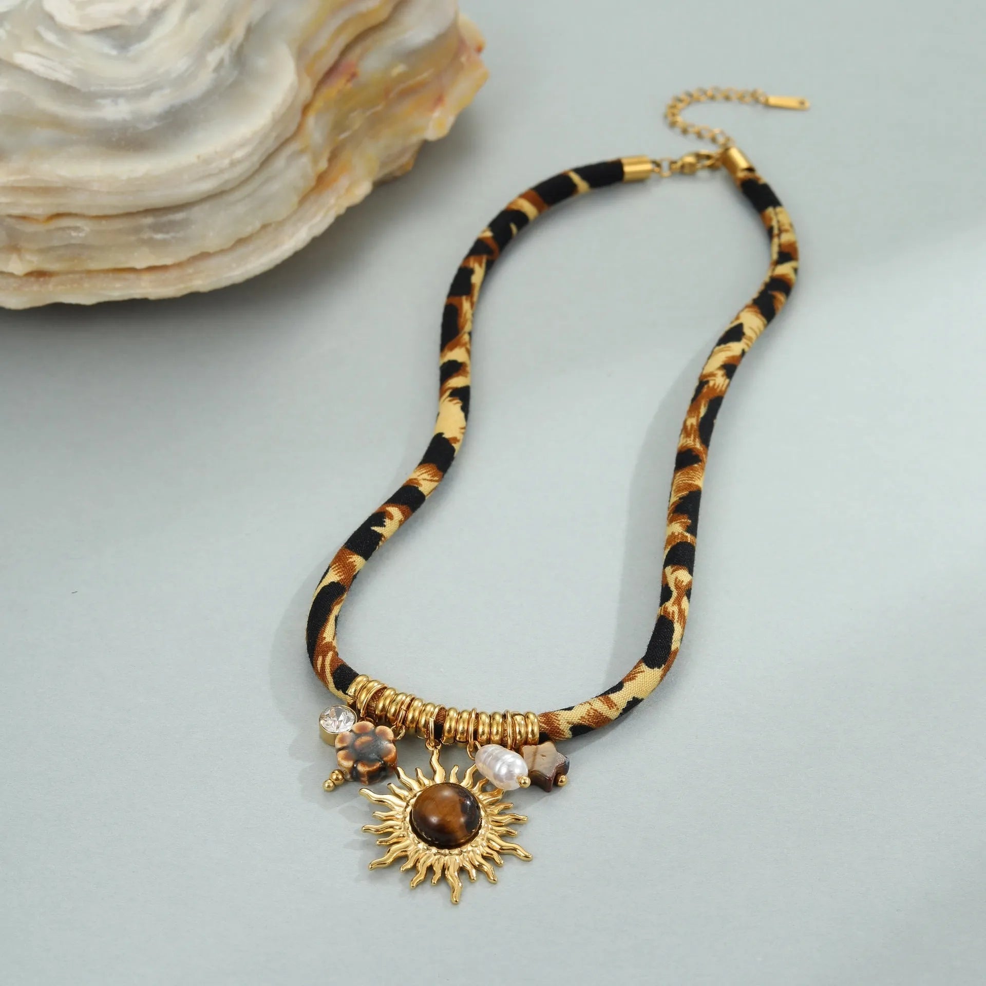Leopard series stainless steel necklace with geometric pendant on a gold-colour chain