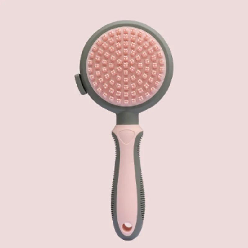 Green and pink dual-sided pet brush showing slicker brush side and silicone massage head side