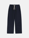 Men's black fleece-lined sweatpants with a drawstring elastic waistband shown in a loose fit.