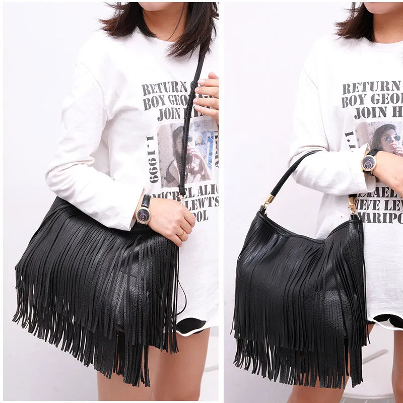 Double-sided tassel handbag in black or brown PU, 33cm wide, 29cm high, 6cm thick, with adjustable 124cm strap.