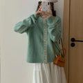 Artistic retro Korean loose fit cardigan coat in viscose fibre, shown in apricot colour.