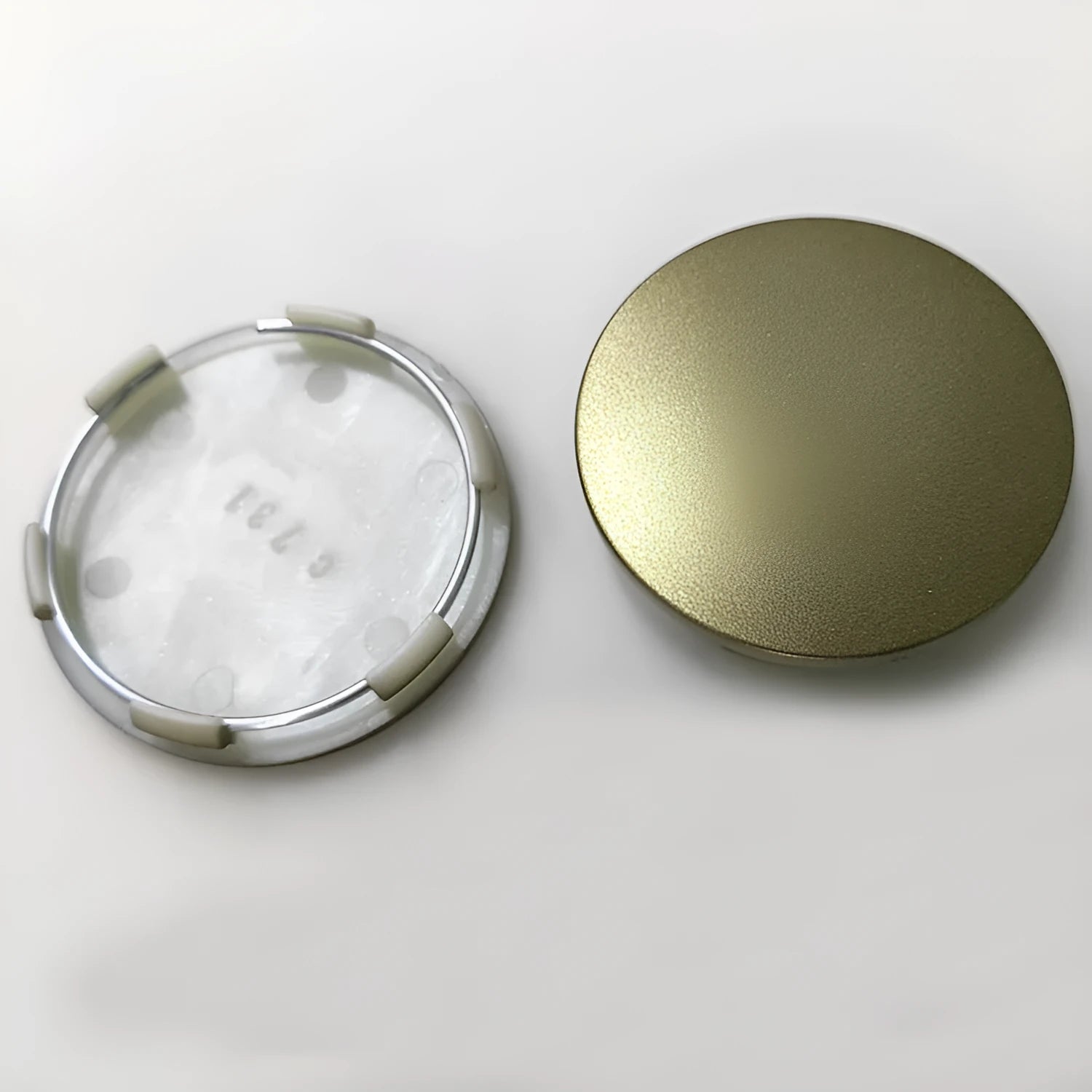 65mm diameter ABS plastic car hub centre cover in antique copper finish with aluminium label.