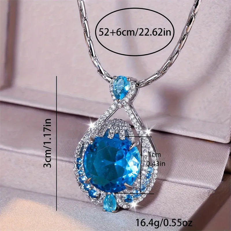 Blue geometric crystal pendant necklace on a silver water wave chain for women