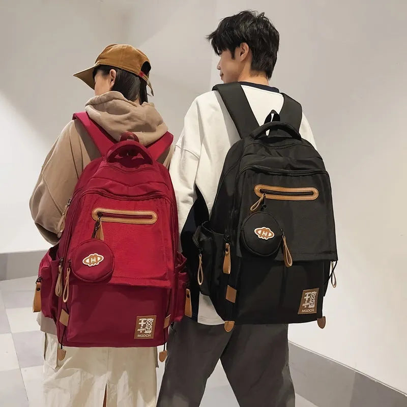 Large-capacity nylon school backpack for middle school students with curved shoulder straps in multiple colour options