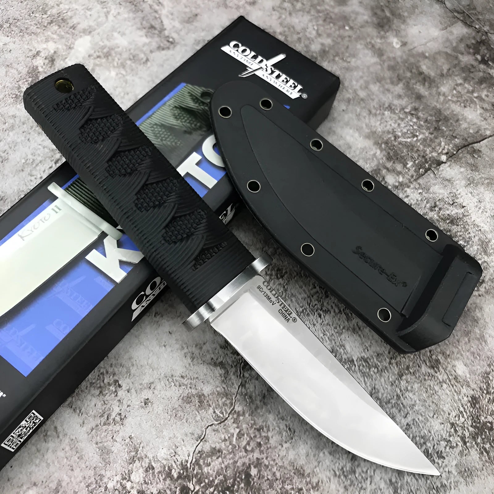 Wild mini straight knife with 440C steel blade, ABS handle, and nylon sheath on outdoor background